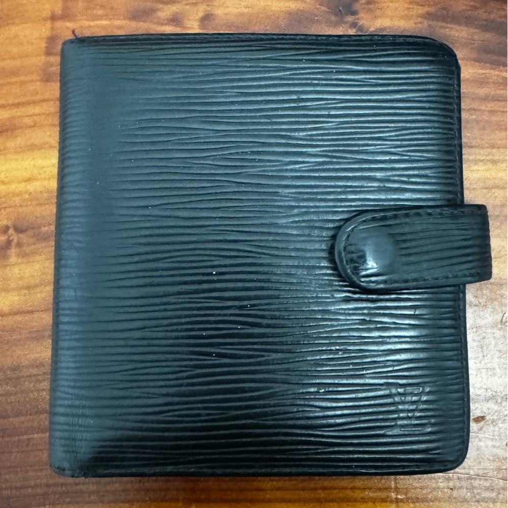 LV wallet with snap and coin pouch.